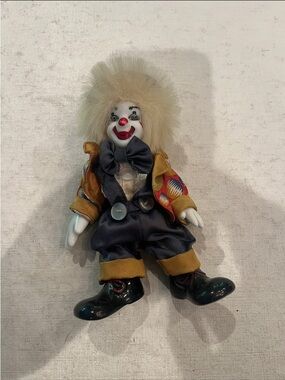 Vintage creepy porcelain Clown Doll with suspenders, jacket and crazy hair. GUC!